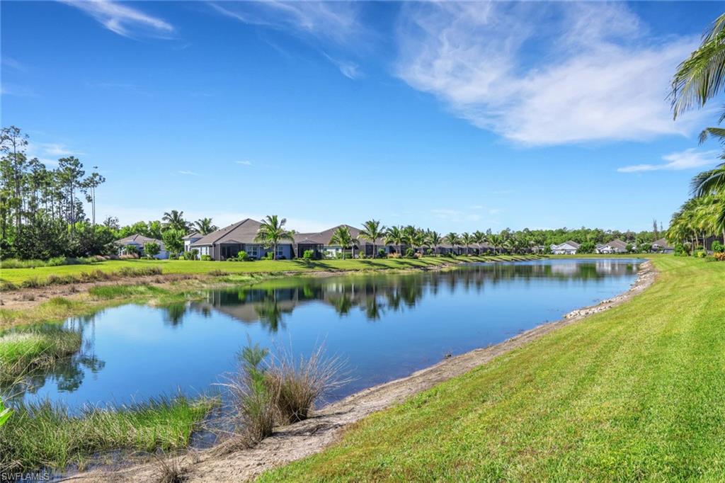 2231 Marquesa Circle Naples, FL 34112 - Photo 29 of 38 a view of a lake with a city