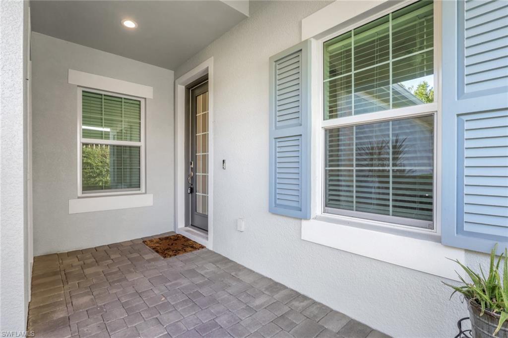 2231 Marquesa Circle Naples, FL 34112 - Photo 3 of 38 a view of an empty room with a window