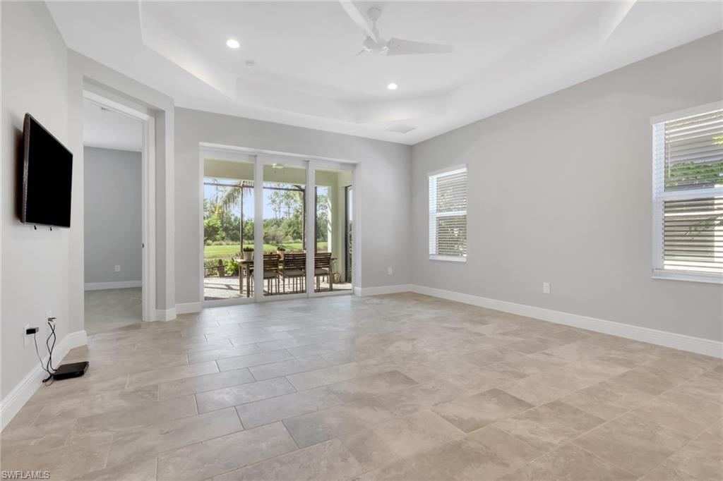 2231 Marquesa Circle Naples, FL 34112 - Photo 6 of 38 a view of an empty room with a window