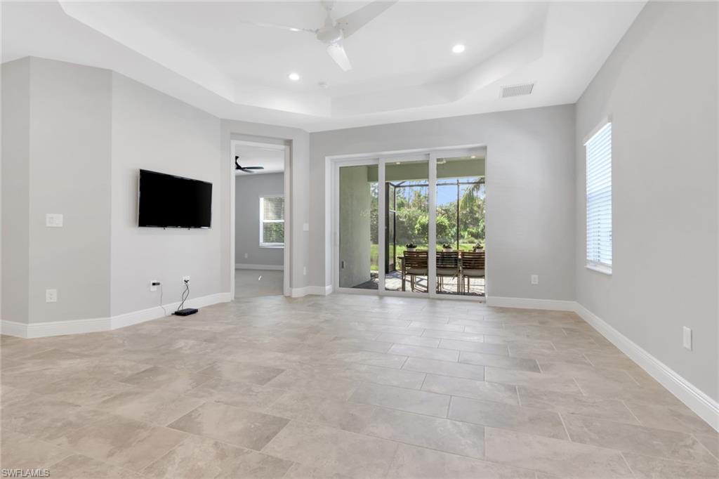 2231 Marquesa Circle Naples, FL 34112 - Photo 9 of 38 a view of an empty room with a window