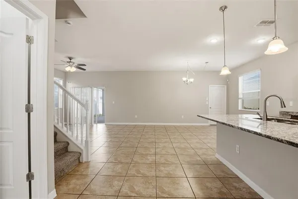 a view of a kitchen with a sink and cabinets