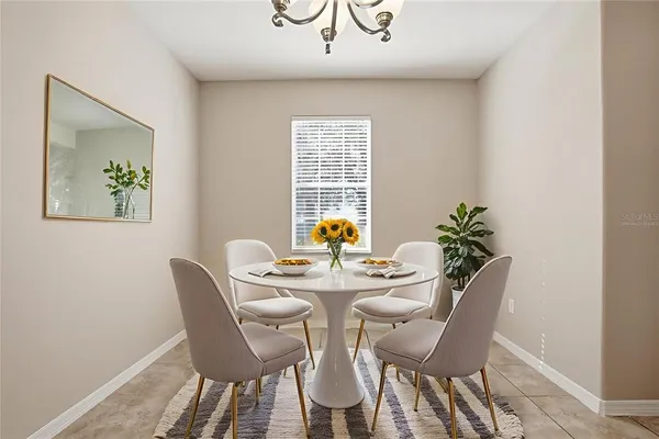 a view of a dining room with furniture wooden floor and a window
