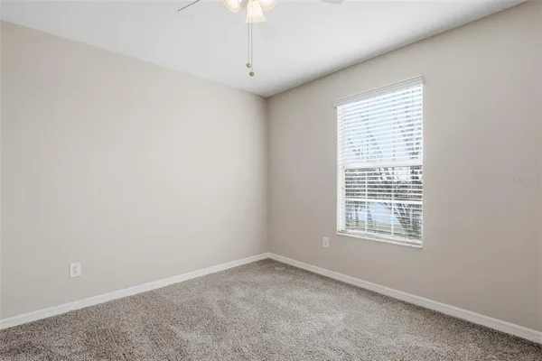 an empty room with closet area