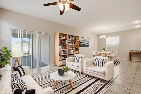 a living room with furniture and a rug