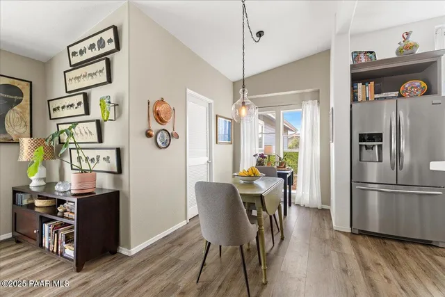 a view of a dining room with furniture window and wooden floor