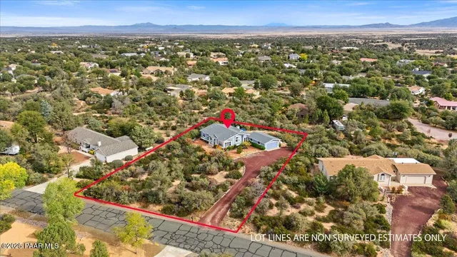 an aerial view of residential house and outdoor space