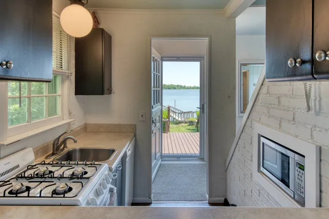 a kitchen with a stove and a sink