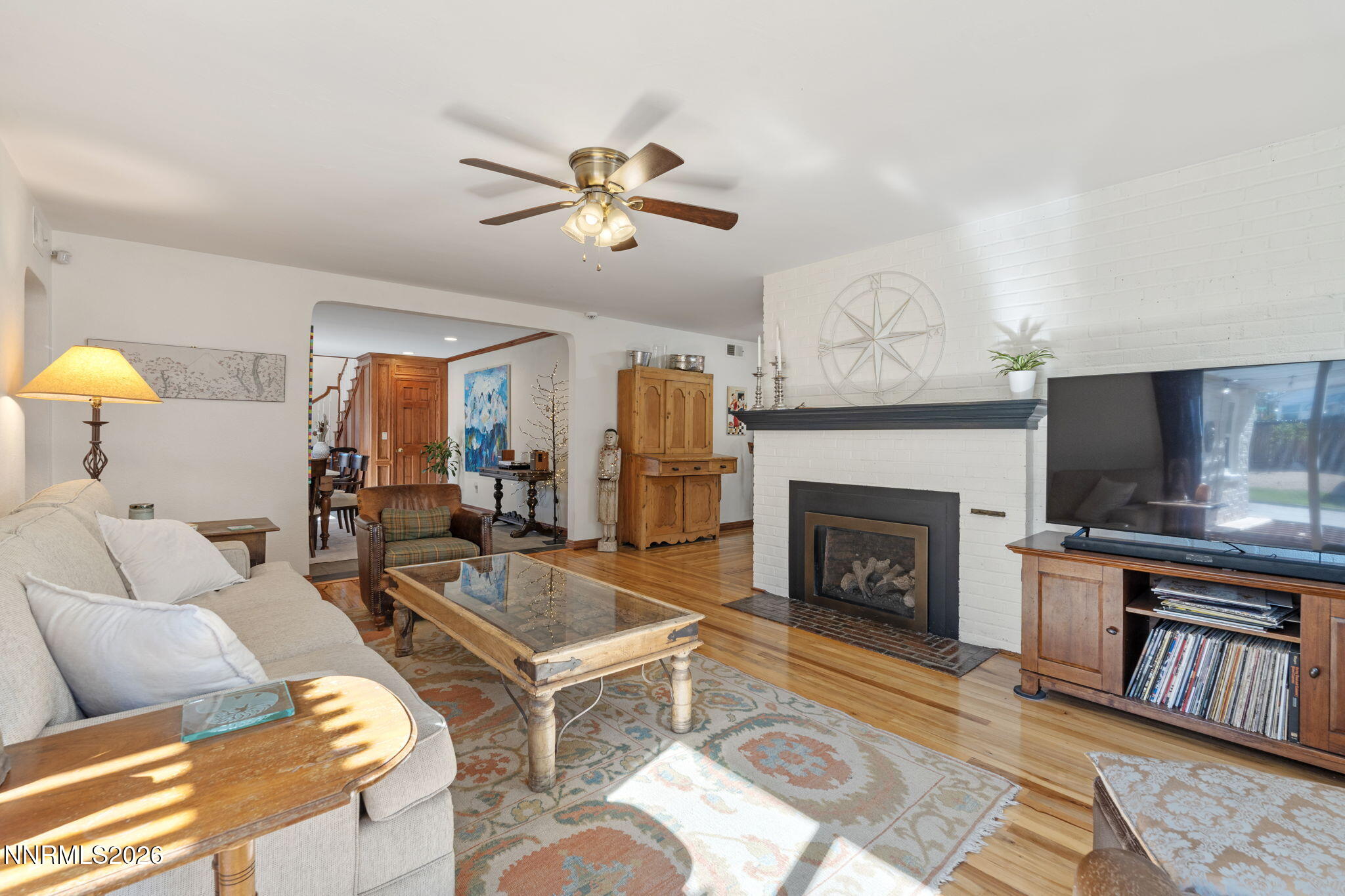300 Country Club Drive Reno, NV 89509 - Photo 11 of 48 a living room with furniture a fireplace and a flat screen tv