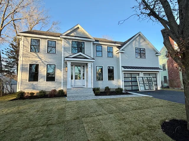 a front view of a house with a yard