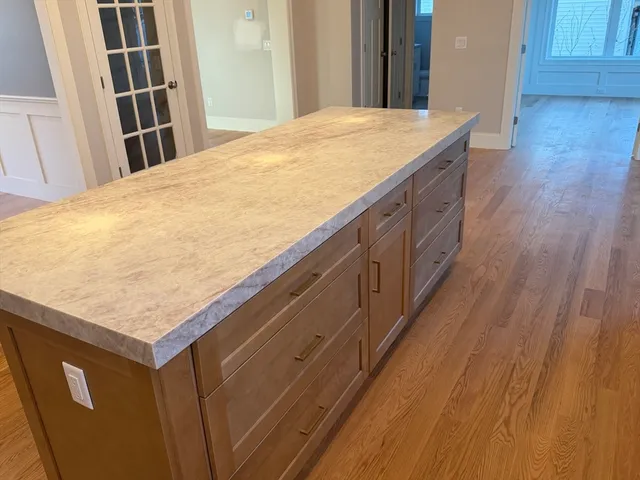 a view of kitchen and wooden floor