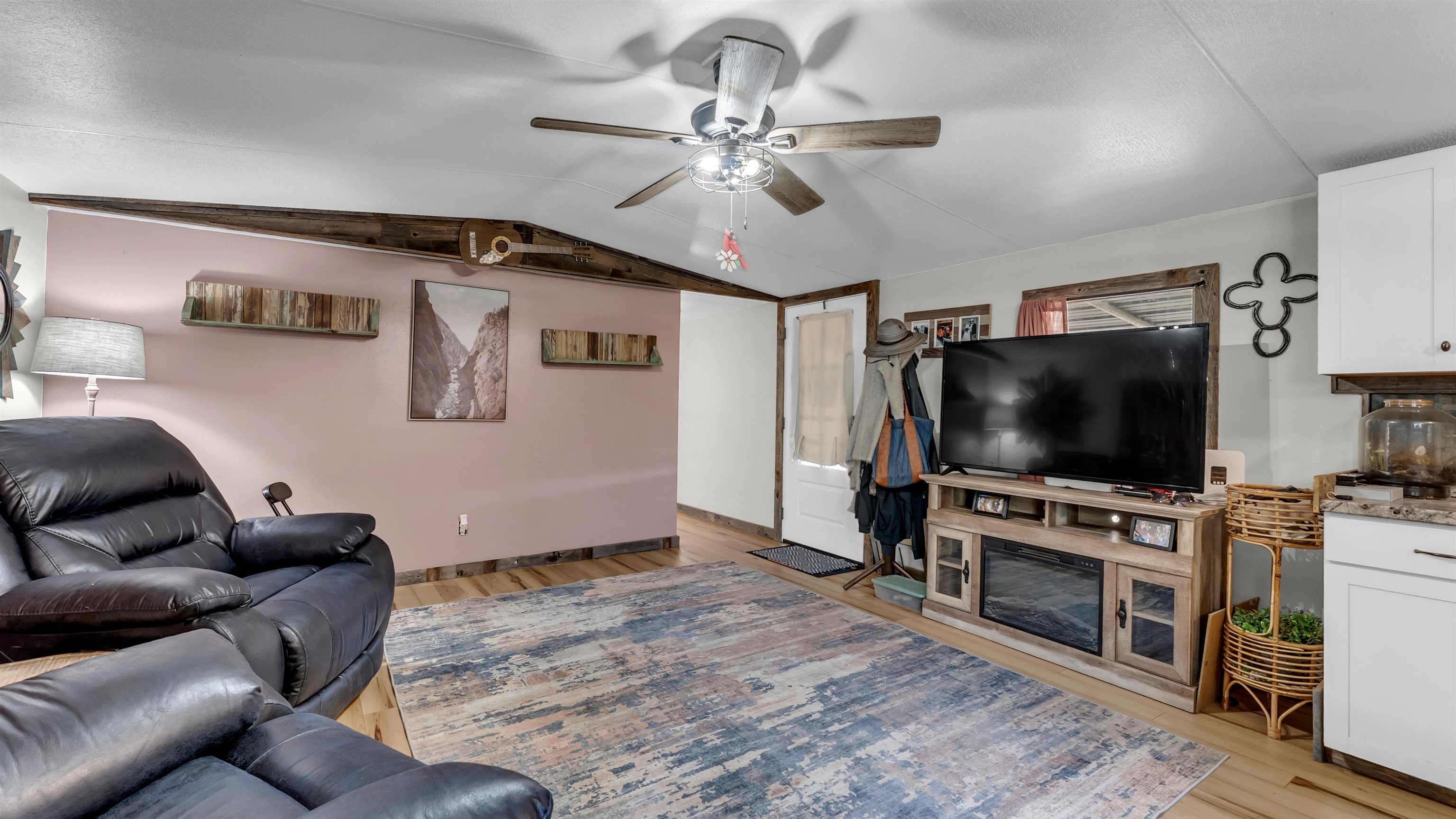 5128 West 29th Highway Bertram, TX 78605 - Photo 12 of 28 a living room with furniture and a flat screen tv