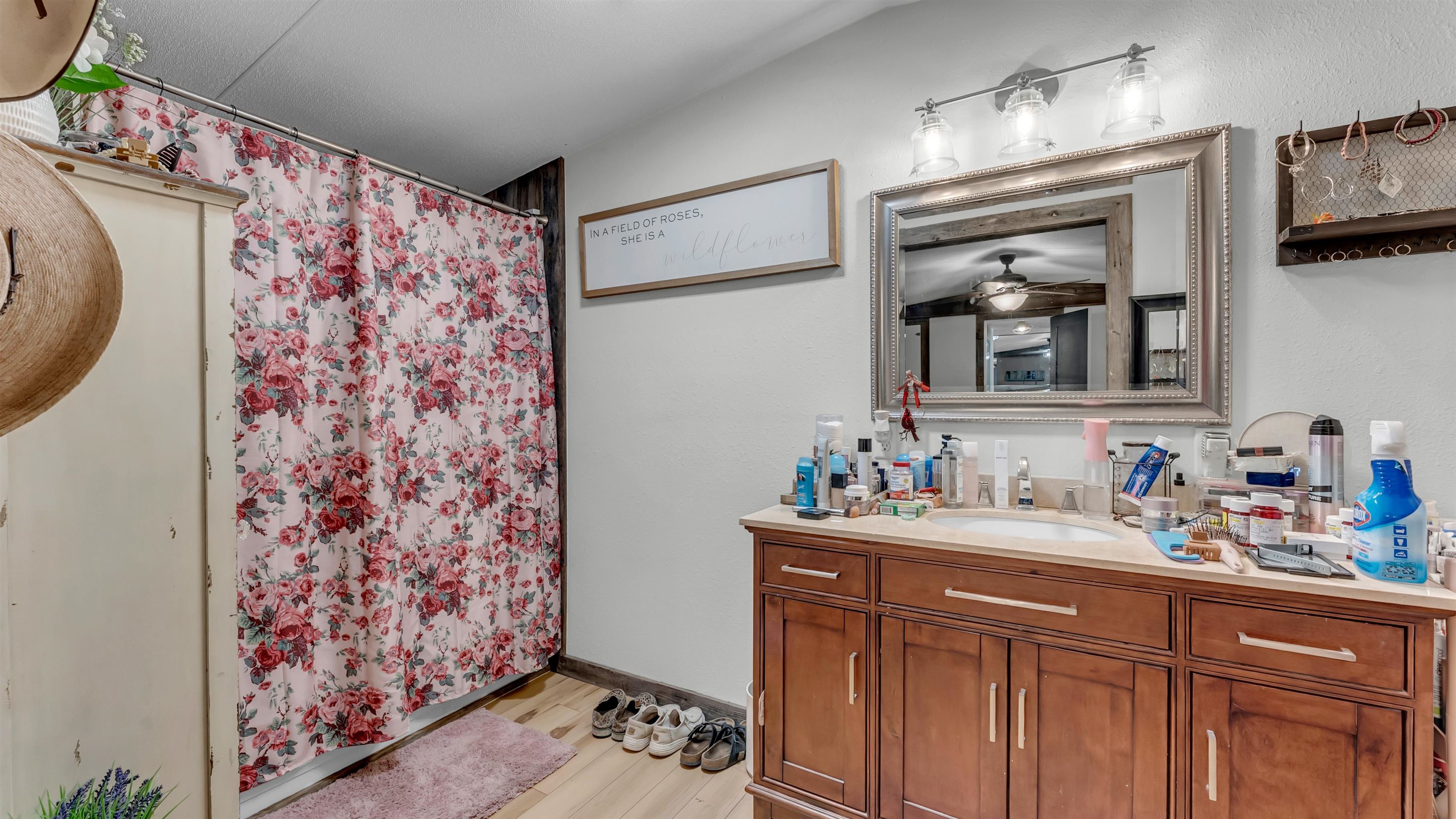 5128 West 29th Highway Bertram, TX 78605 - Photo 14 of 28 a bathroom with a sink mirror and vanity