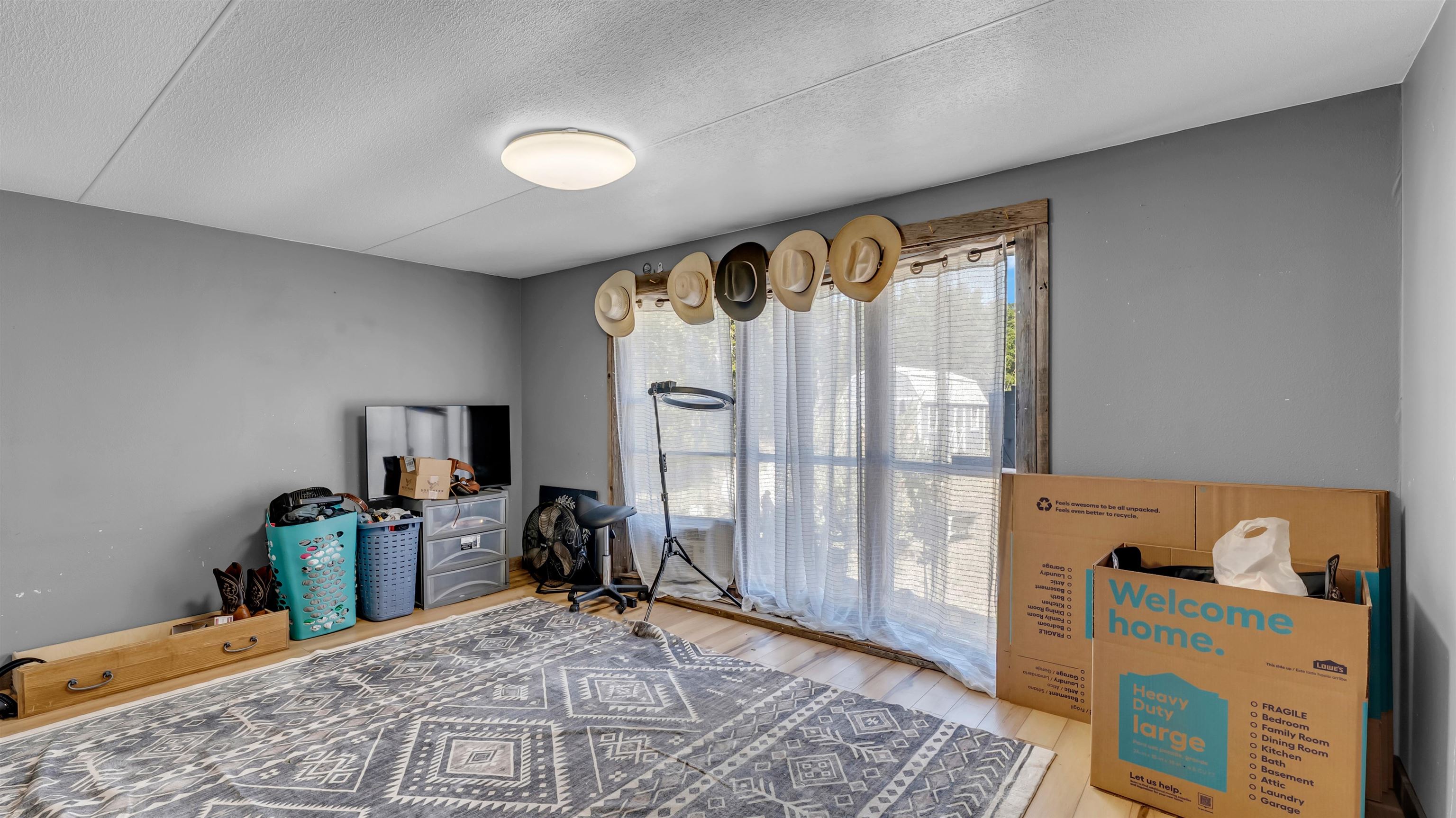 5128 West 29th Highway Bertram, TX 78605 - Photo 17 of 28 a view of a bedroom with workspace and a window