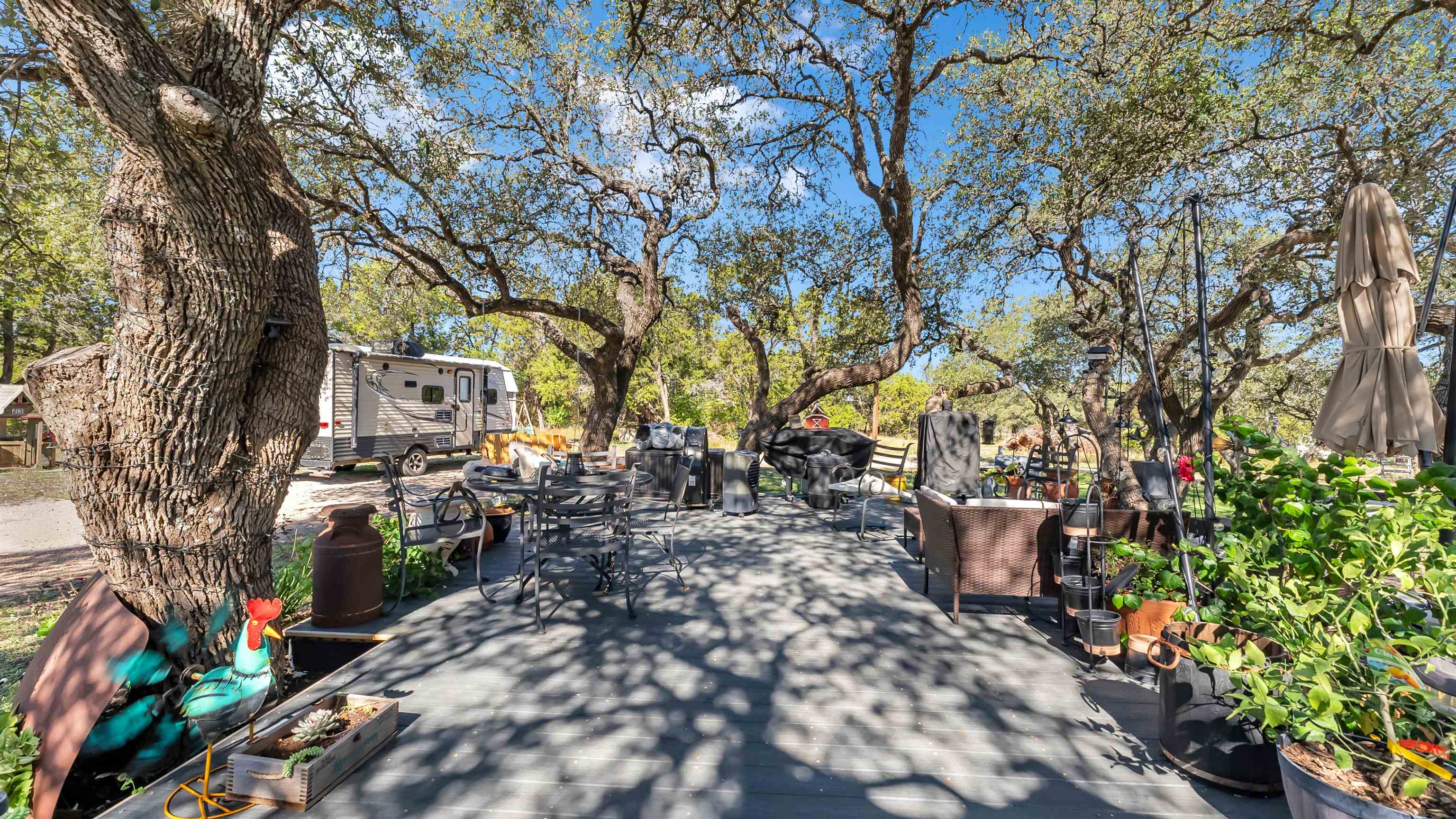 5128 West 29th Highway Bertram, TX 78605 - Photo 20 of 28 a backyard of a house with lots of green space