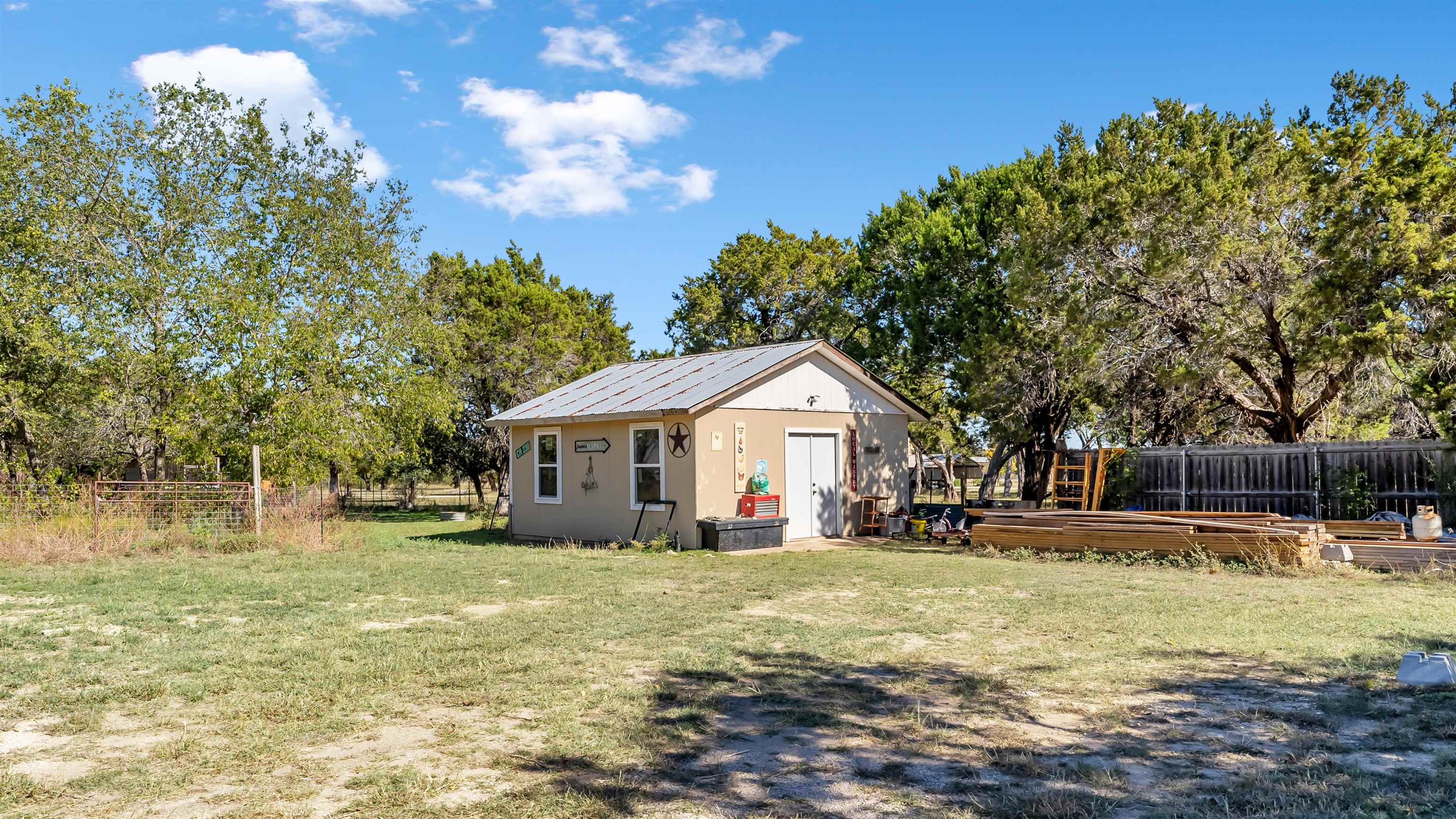 5128 West 29th Highway Bertram, TX 78605 - Photo 22 of 28 a front view of a house with a yard