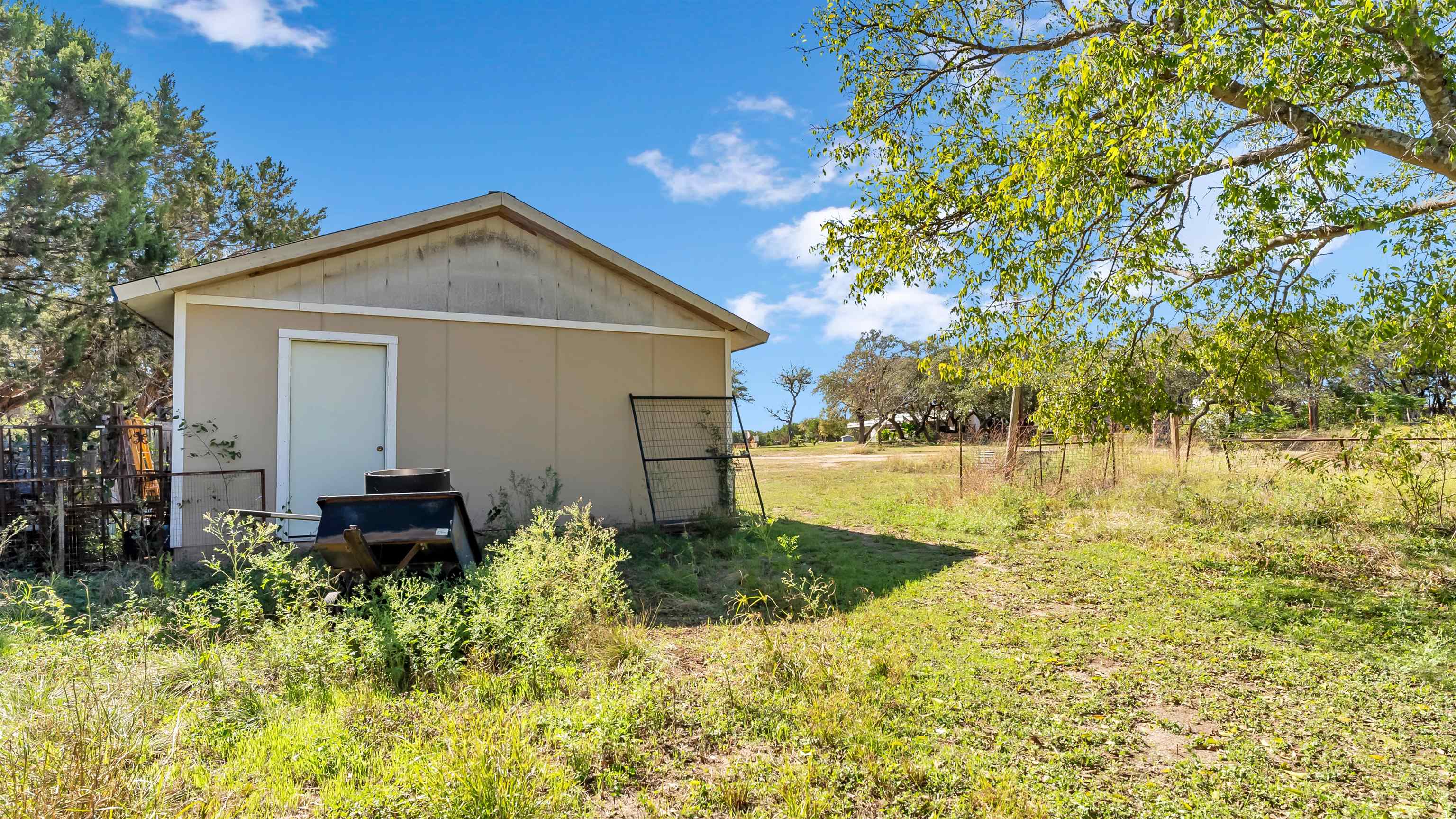 5128 West 29th Highway Bertram, TX 78605 - Photo 23 of 28 a front view of house with yard and green space