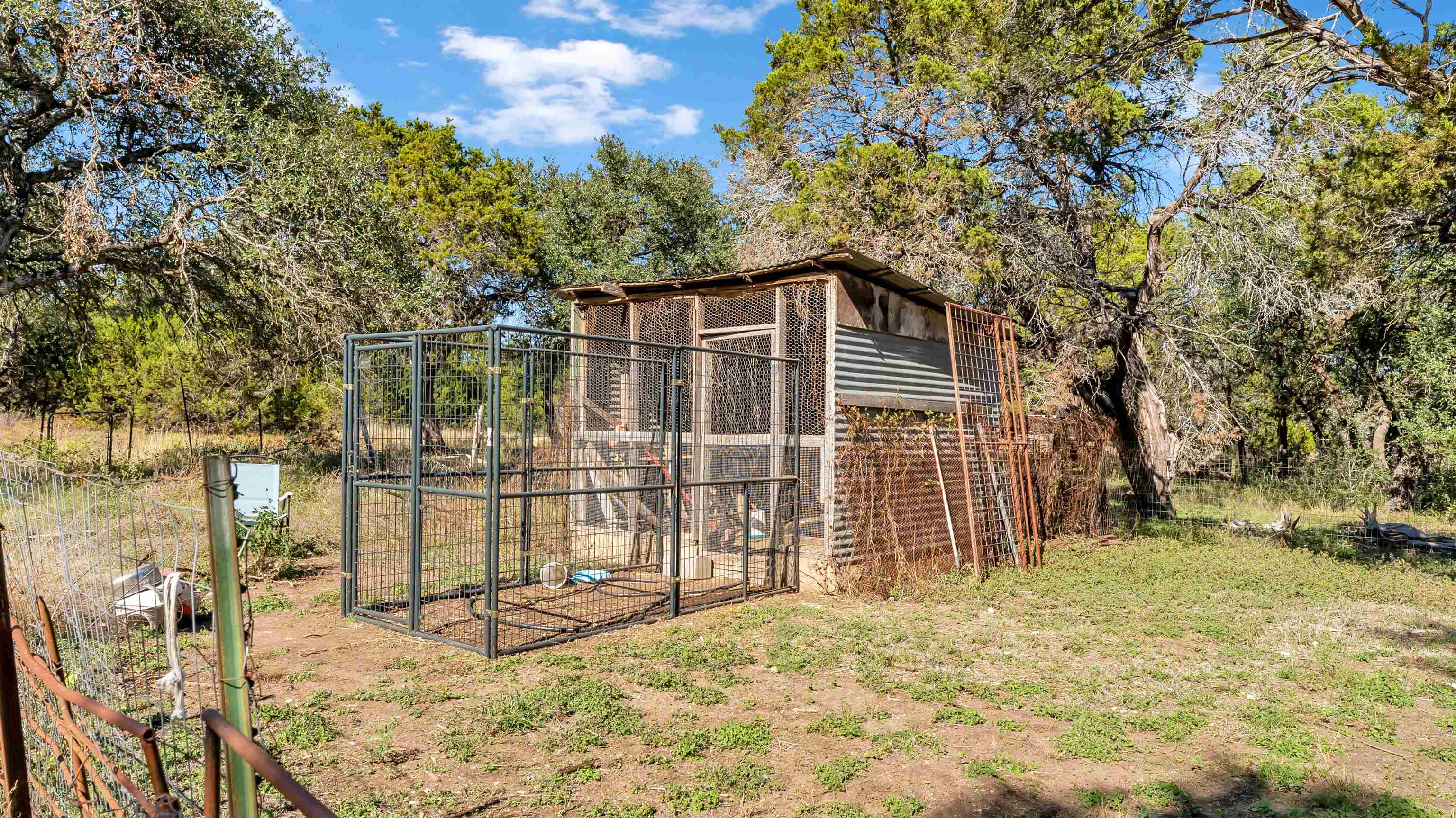 5128 West 29th Highway Bertram, TX 78605 - Photo 24 of 28 a view of a house with a yard and wooden fence