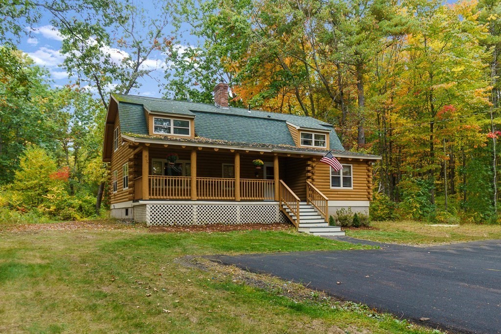 51 Gilchrist Road Townsend, MA 01469 - Photo 3 of 42 a front view of a house with garden