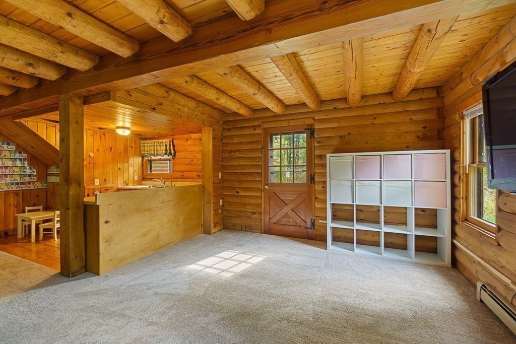 51 Gilchrist Road Townsend, MA 01469 - Photo 32 of 42 a view of an empty room with wooden floor and windows