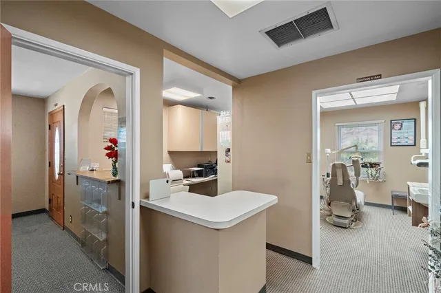 a en suite bathroom with a sink vanity and mirror