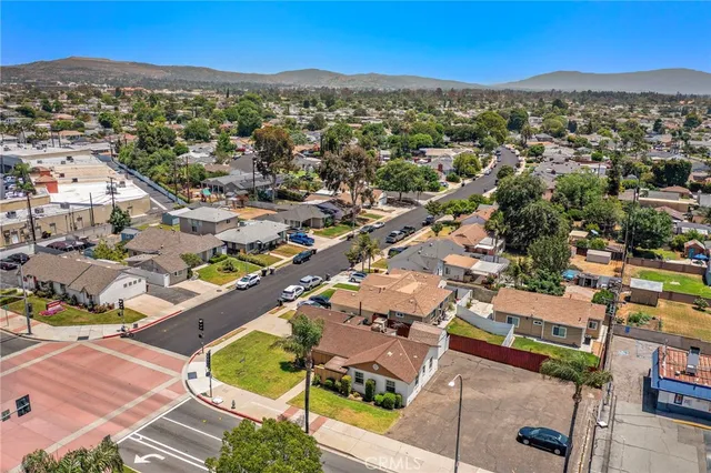 an aerial view of residential houses with outdoor space