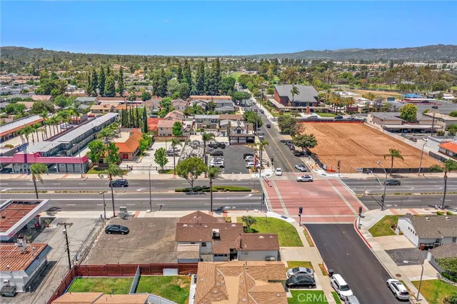 an aerial view of residential houses and outdoor space