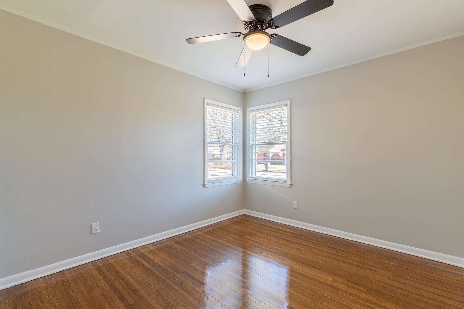 1511 Raymore Road Memphis, TN 38117 - Photo 15 of 21 an empty room with wooden floor fan and windows