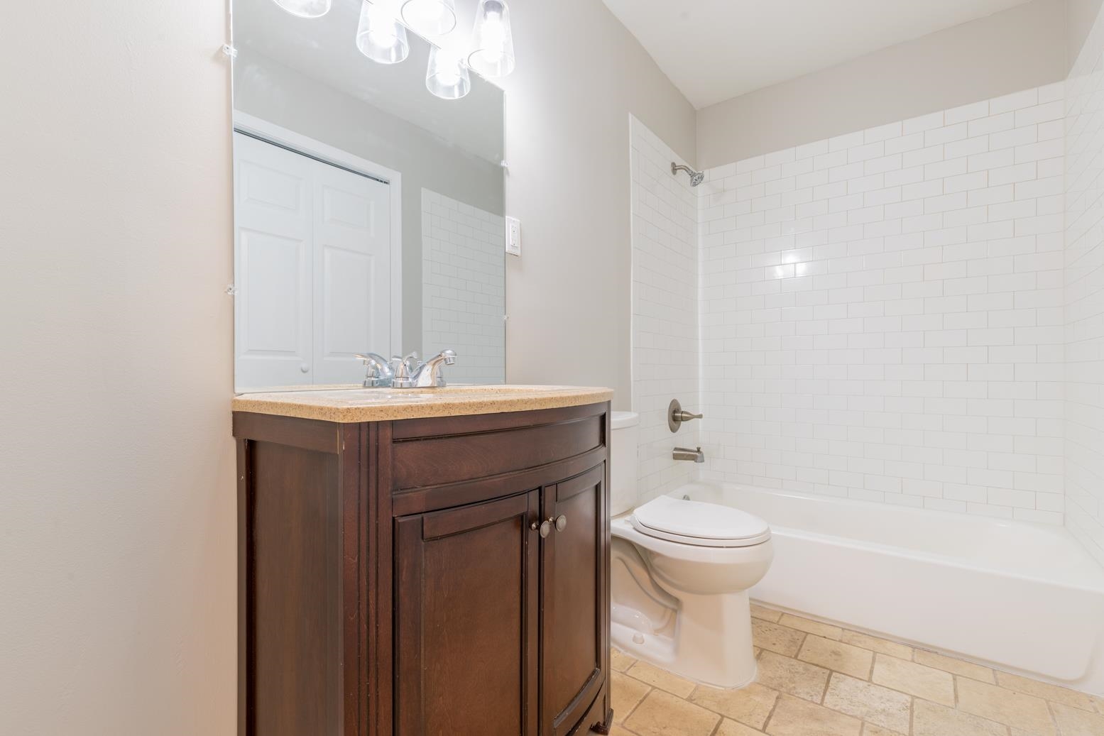 1511 Raymore Road Memphis, TN 38117 - Photo 17 of 21 a bathroom with a sink a toilet and a mirror