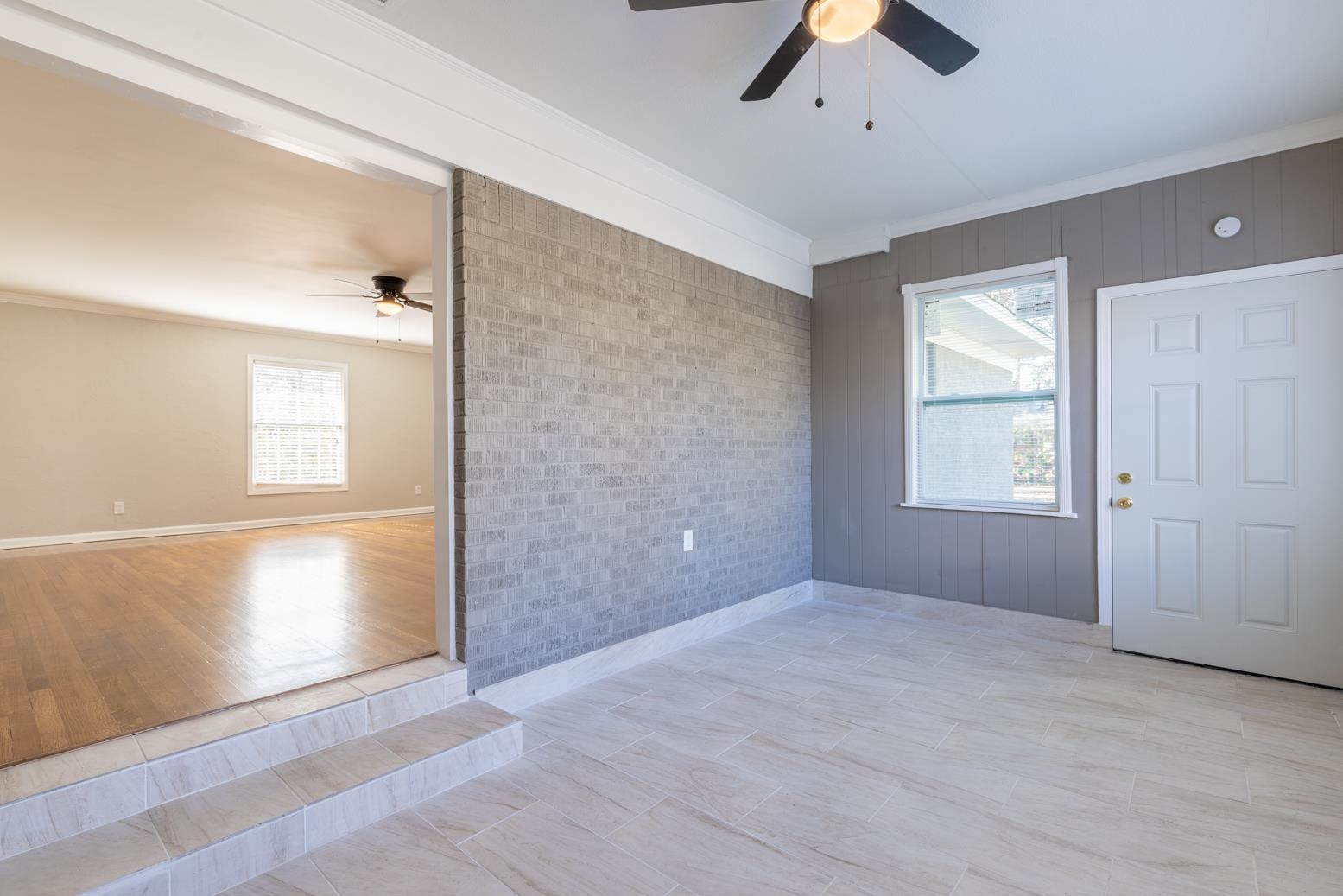 1511 Raymore Road Memphis, TN 38117 - Photo 19 of 21 a view of an empty room with window and chandelier fan