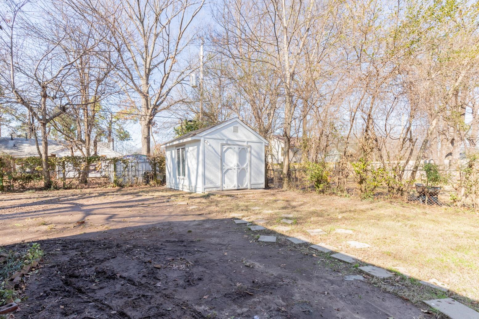 1511 Raymore Road Memphis, TN 38117 - Photo 20 of 21 a front view of a house with a yard and covered with snow