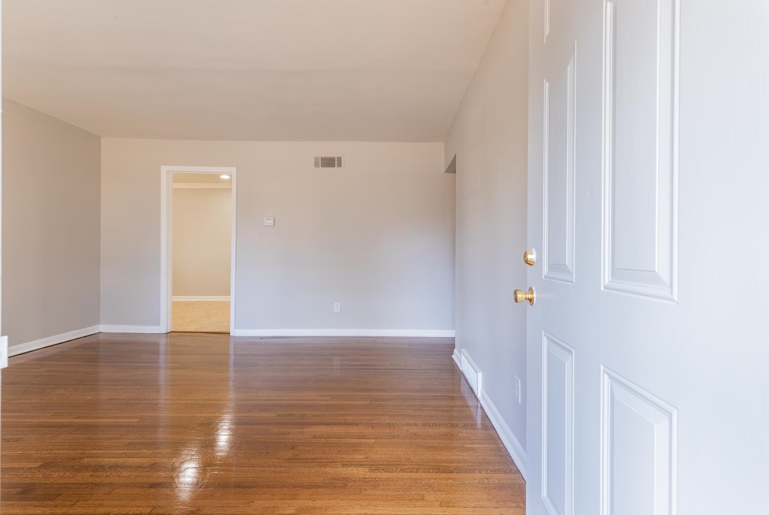 1511 Raymore Road Memphis, TN 38117 - Photo 4 of 21 a view of an empty room with wooden floor