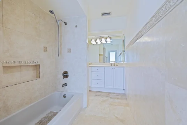 a bathroom with a bath tub