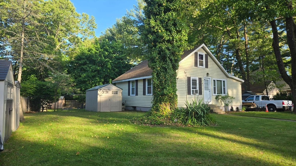 32 Birch Road Natick, MA 01760 - Photo 3 of 38 a front view of a house with garden