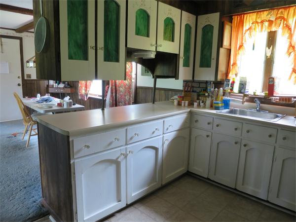 56 Ely Road Monson, MA 01057 - Photo 4 of 15 a kitchen with stainless steel appliances granite countertop a sink and a large window