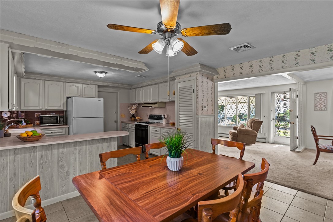 47 Mockingbird Drive Cranston, RI 02920 - Photo 6 of 28 Kitchen, dining area and living room