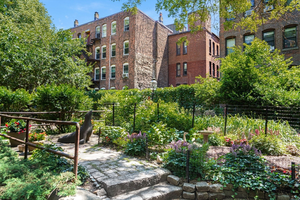 1 Unity Street, Unit 2F Boston, MA 02113 - Photo 12 of 16 a view of a large brick building next to a yard