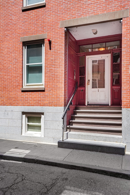 1 Unity Street, Unit 2F Boston, MA 02113 - Photo 13 of 16 a front view of a house with stairs