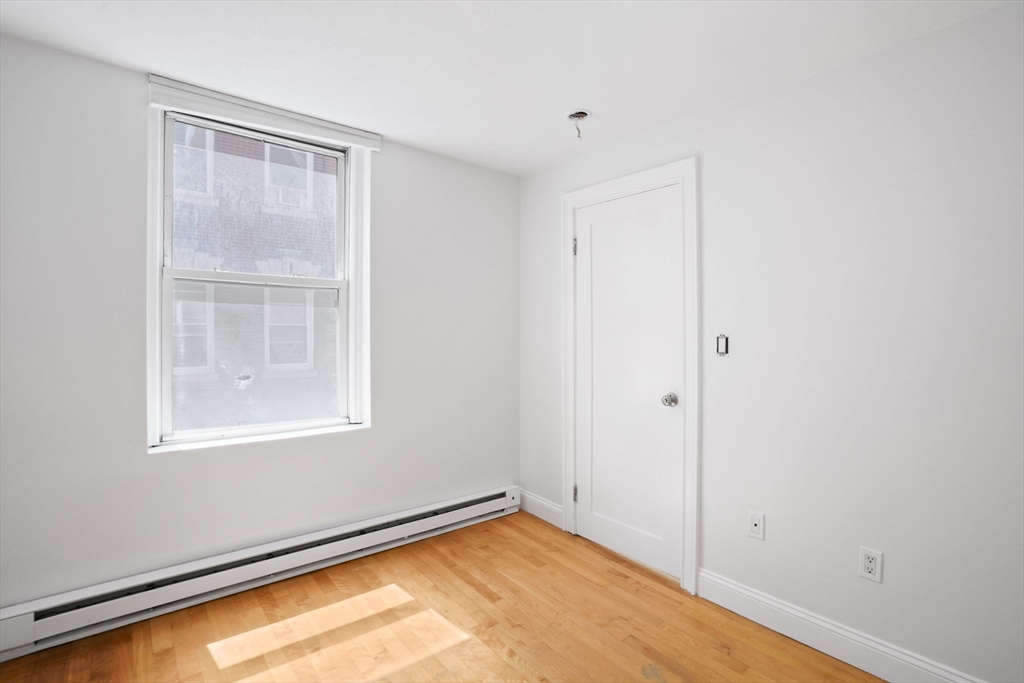 1 Unity Street, Unit 2F Boston, MA 02113 - Photo 7 of 16 a view of an empty room with a window