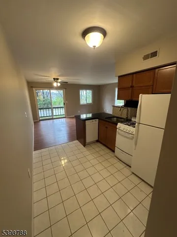 a kitchen with a sink a stove and cabinets
