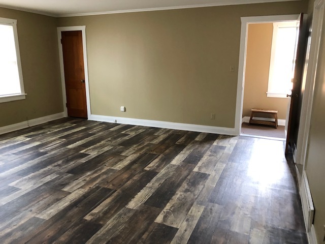 3311-3315 Waukegan Road McHenry, IL 60050 - Photo 11 of 16 a view of a room with wooden floor and a window