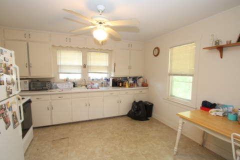 3311-3315 Waukegan Road McHenry, IL 60050 - Photo 13 of 16 a kitchen with a white cabinets and window