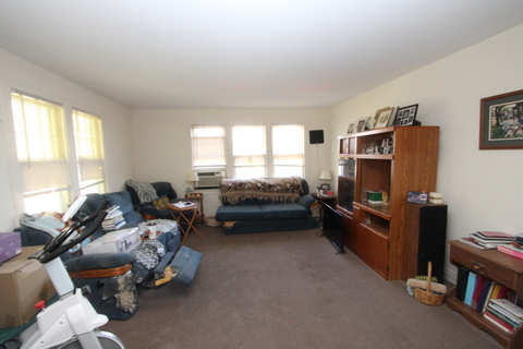 3311-3315 Waukegan Road McHenry, IL 60050 - Photo 15 of 16 a living room with furniture window and a flat screen tv