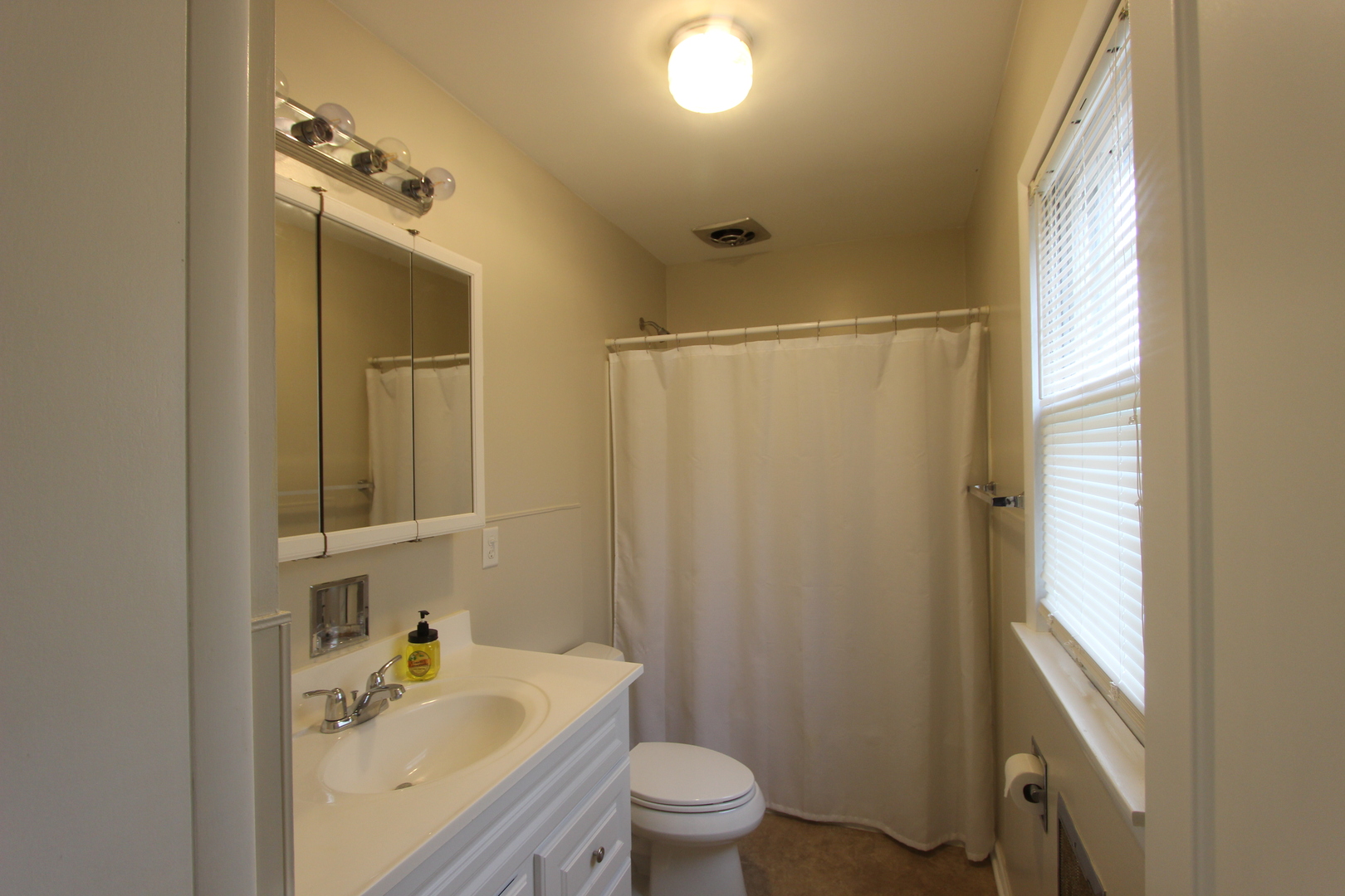 3311-3315 Waukegan Road McHenry, IL 60050 - Photo 5 of 16 a bathroom with a sink toilet and shower