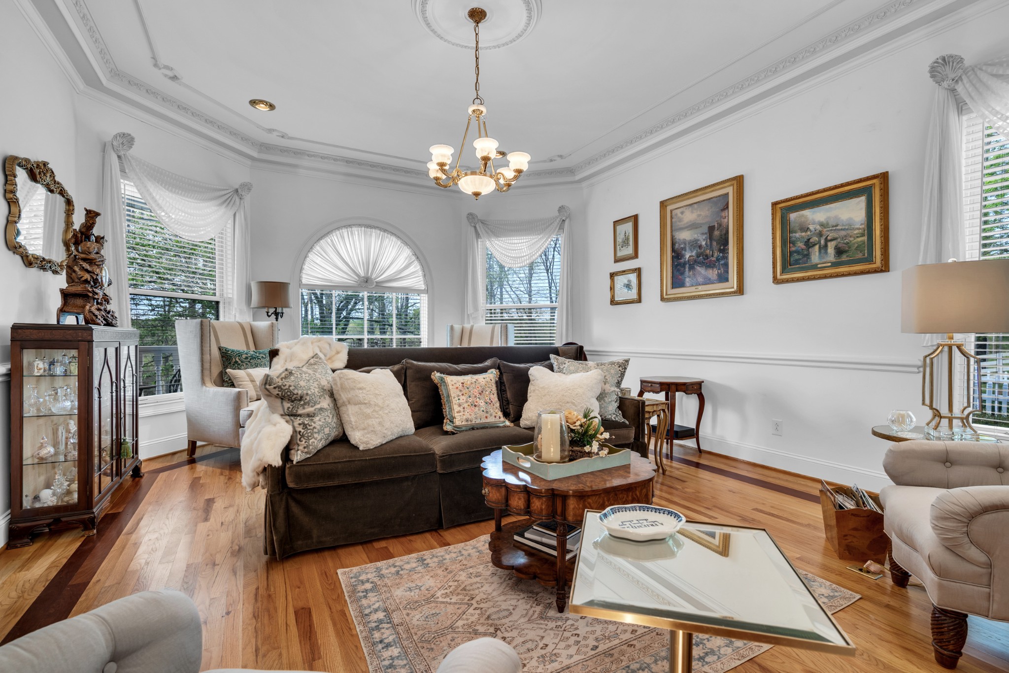 515 Cox Hollow Road Dover, TN 37058 - Photo 15 of 57 a living room with furniture a chandelier a rug and a chandelier