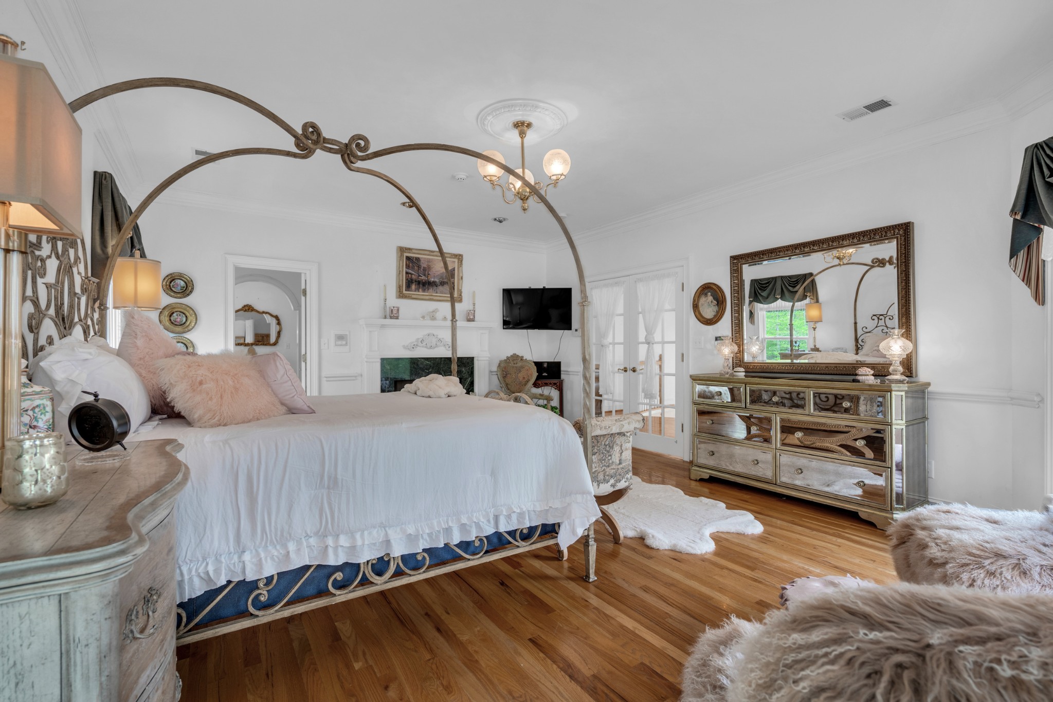 515 Cox Hollow Road Dover, TN 37058 - Photo 27 of 57 a bedroom with a bed and a flat tv screen on dresser