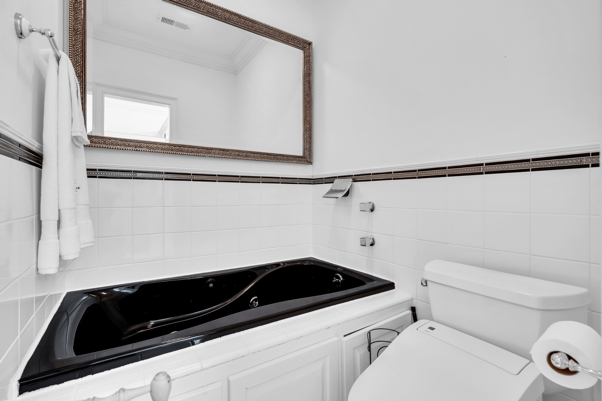 515 Cox Hollow Road Dover, TN 37058 - Photo 30 of 57 a bathroom with a sink a toilet and a mirror