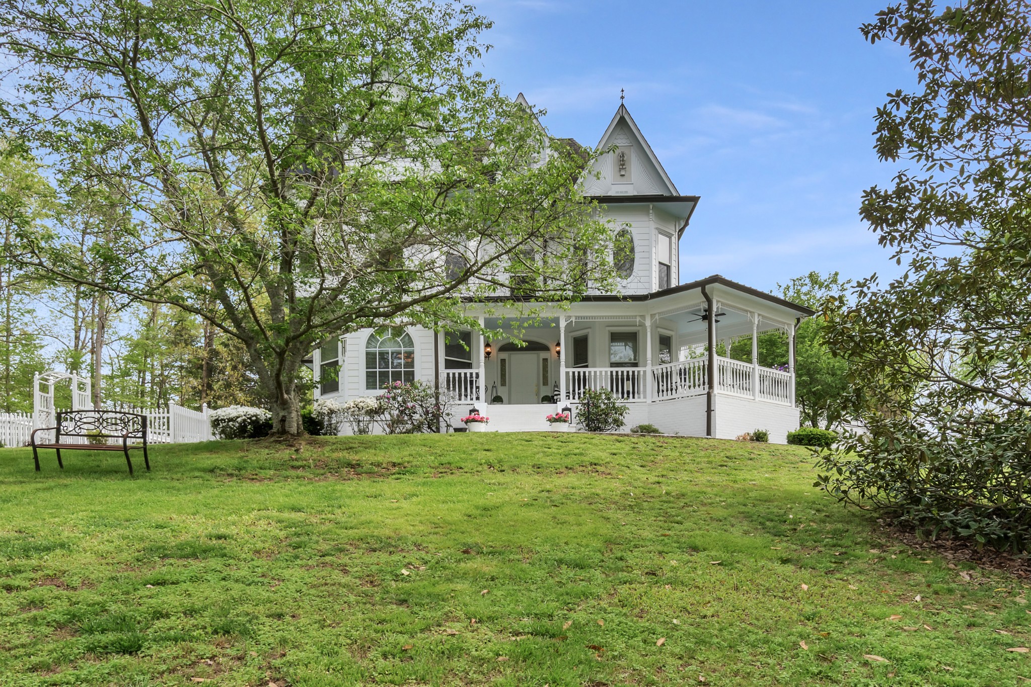 515 Cox Hollow Road Dover, TN 37058 - Photo 4 of 57 a front view of a house with a garden and trees