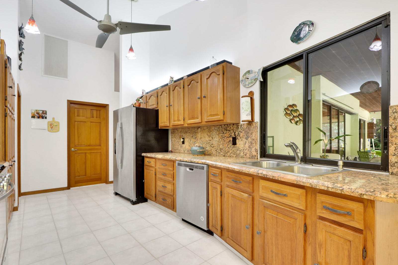 15359 Alexander Run Jupiter, FL 33478 - Photo 9 of 39 kitchen with pass through window