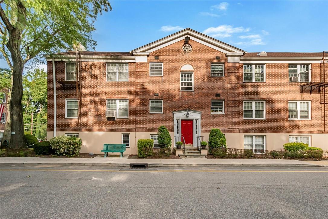 53 Rockledge Road, Unit 12B Bronxville, NY 10708 - Photo 1 of 1 front view of a house with a street