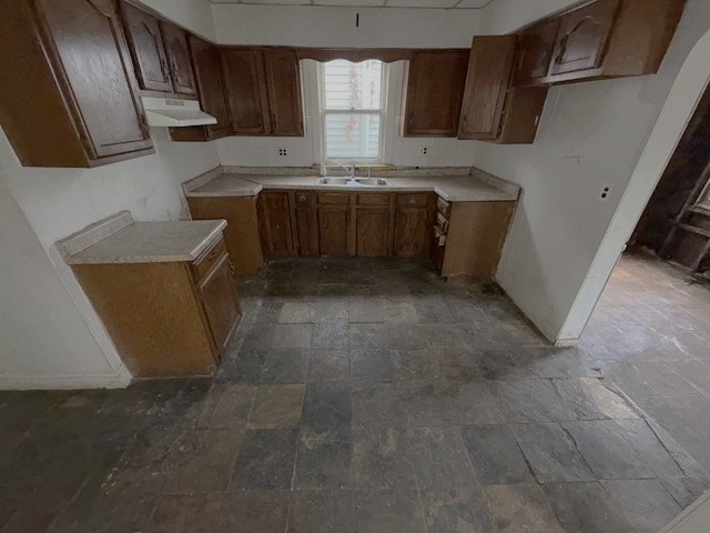 7514 South Rhodes Avenue Chicago, IL 60619 - Photo 3 of 11 a kitchen with stainless steel appliances granite countertop a stove a sink and a microwave